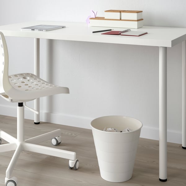 A white FNISS waste bin