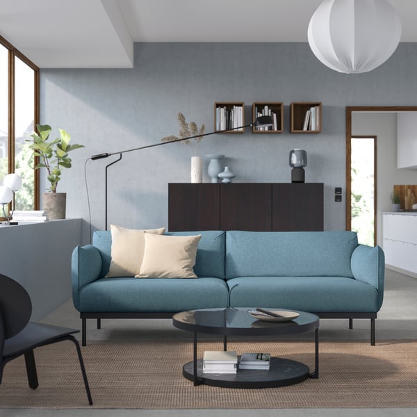 A Gunnared light blue ÄPPLARYD 3-seat sofa in the living room