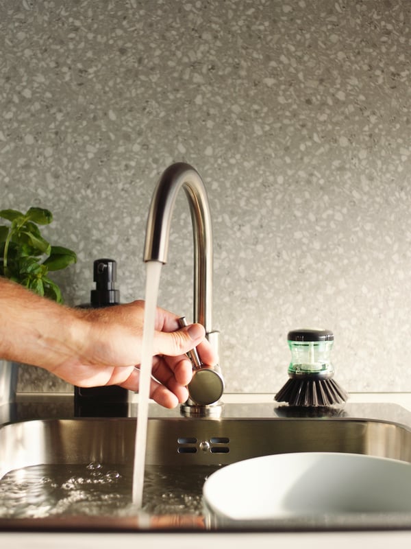 A stainless steel effect GLYPEN mixer tap in the kitchen