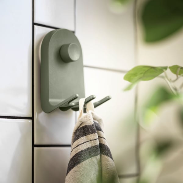 A grey-green ÖBONÄS triple hook with suction cup