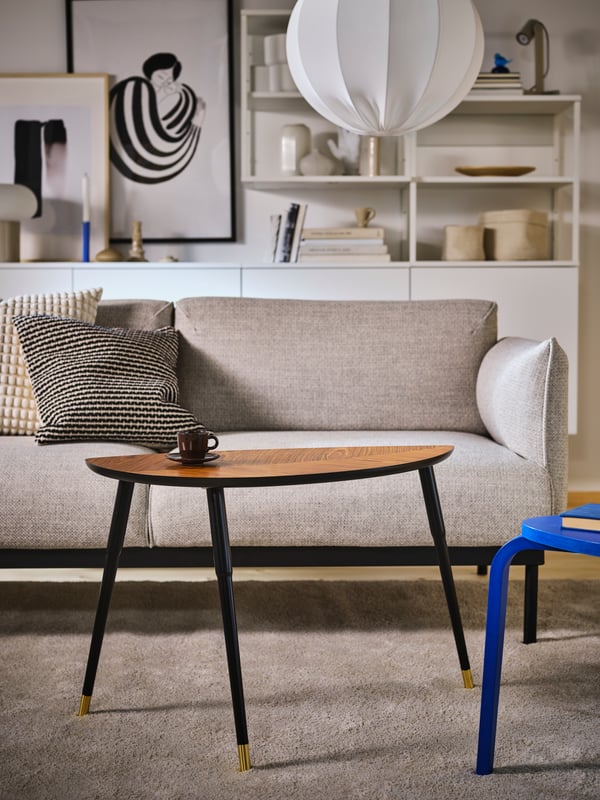 An off-white SVARTPOPPEL cushion cover