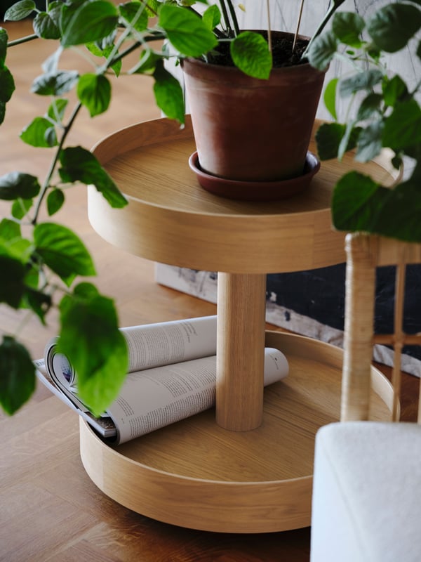 An oak veneer STOCKHOLM 2025 side table on castors