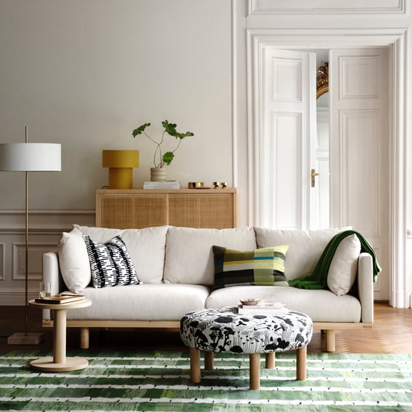 An in/outdoor/beige HASSELBUKETT plant pot in the living room